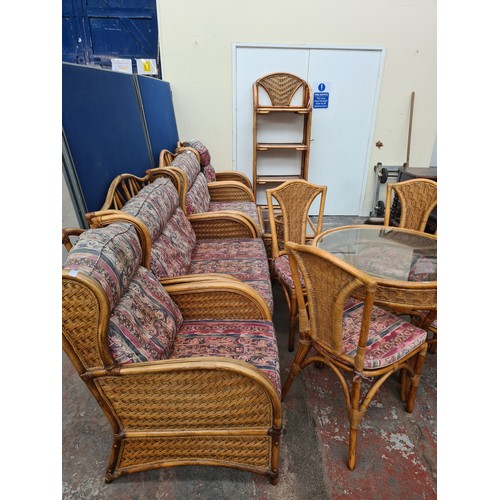 58A - A bamboo and wicker thirteen piece conservatory suite comprising two sofas, two armchairs, four tier... 