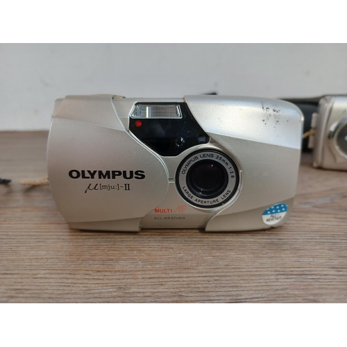 653 - Three cased Olympus mju compact cameras, one µ[mju:]-II Zoom 80 35mm, one µ[mju:]-II 35mm and one µ ... 