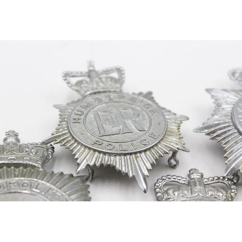 1196 - Five vintage Police helmet plates to include Brighton, Humberside, Lincolnshire etc.