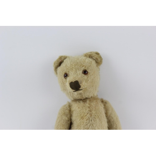 352 - A vintage jointed teddy bear - approx. 23cm high