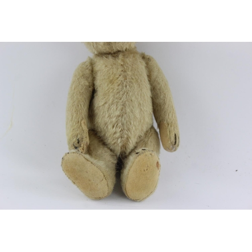 352 - A vintage jointed teddy bear - approx. 23cm high