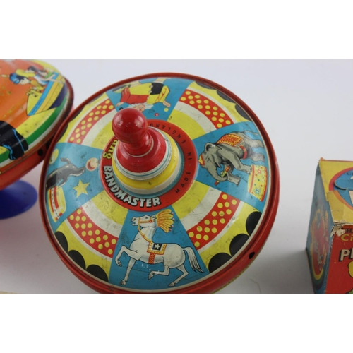 355 - Six vintage tinplate toys to include spinning tops, Songster Xylophone etc.