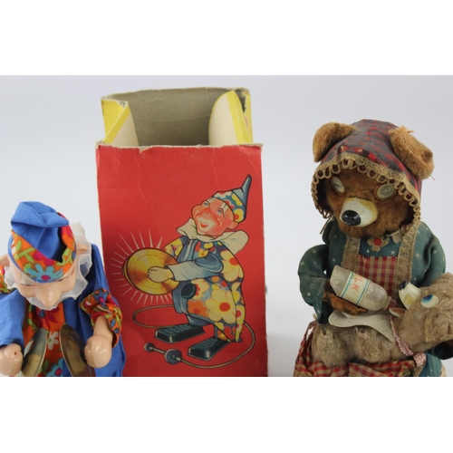 358 - Three vintage tinplate toys to include Hungry Baby Bear, Tri-ang Minic Kitty and Butterfly etc.