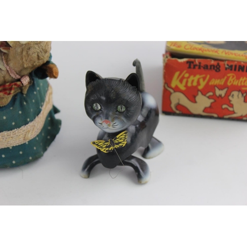 358 - Three vintage tinplate toys to include Hungry Baby Bear, Tri-ang Minic Kitty and Butterfly etc.