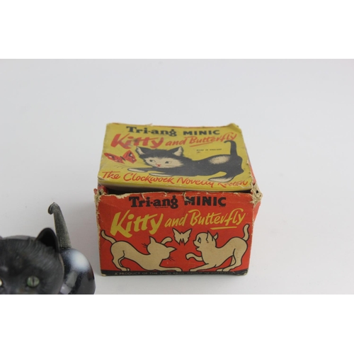 358 - Three vintage tinplate toys to include Hungry Baby Bear, Tri-ang Minic Kitty and Butterfly etc.