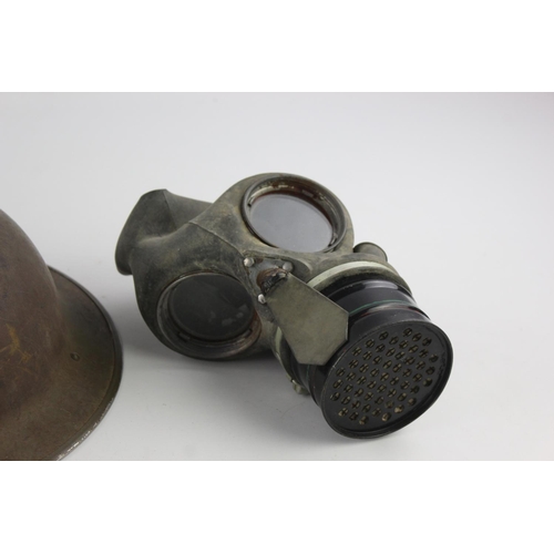 472 - Three pieces of militaria, one gas mask, one 1945 webbing bag and one helmet