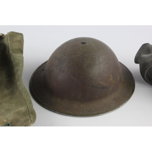 472 - Three pieces of militaria, one gas mask, one 1945 webbing bag and one helmet