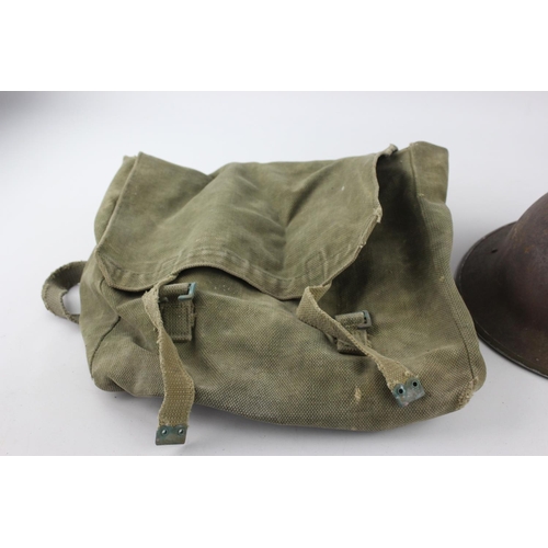 472 - Three pieces of militaria, one gas mask, one 1945 webbing bag and one helmet