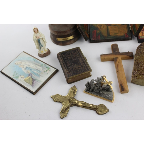 473 - A collection of religious items to include mother of pearl Bible, artwork, crucifix etc.