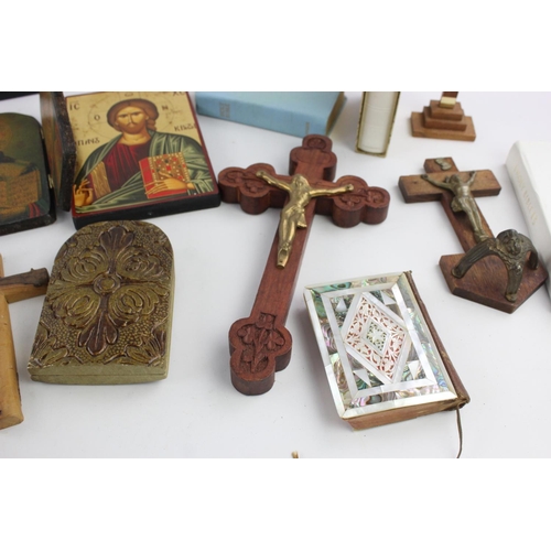 473 - A collection of religious items to include mother of pearl Bible, artwork, crucifix etc.