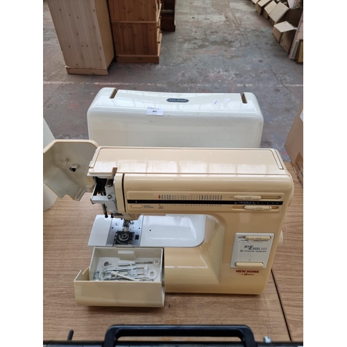 807 - A cased Janome New Home My Excel 23X electric sewing machine with attachments