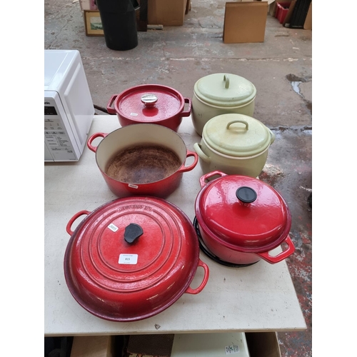 815 - Six twin handled cooking pots to include Le Creuset, Molten, Pyrex etc.