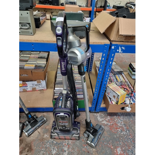 822 - Two bagless vacuum cleaners, one Shark FX950UK upright and one Vax Blade cordless