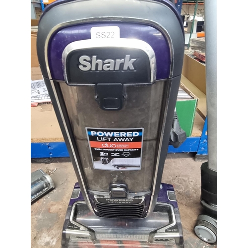 822 - Two bagless vacuum cleaners, one Shark FX950UK upright and one Vax Blade cordless