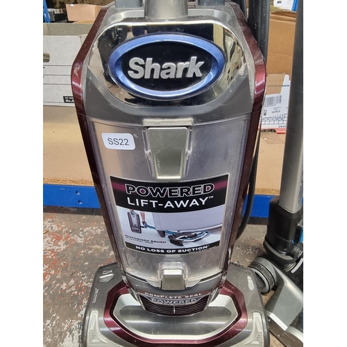 823 - Two bagless vacuum cleaners, one Shark NV680UKT upright and one Vax Blade cordless