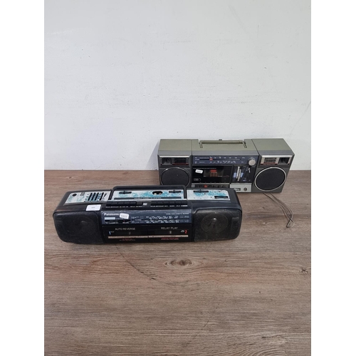 693 - Two portable cassette radios, one Panasonic four band and one Saisho two band