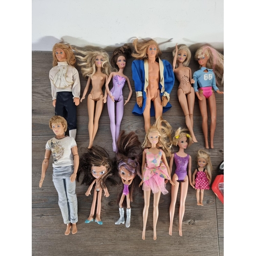 332 - A collection of modern and vintage plastic dolls to include Barbie, Bratz etc. together with a 1992 ... 