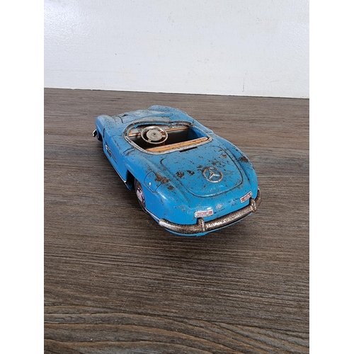 358D - A mid 20th century tinplate Mercedes model vehicle - approx. 6cm high x 9cm wide x 22cm long