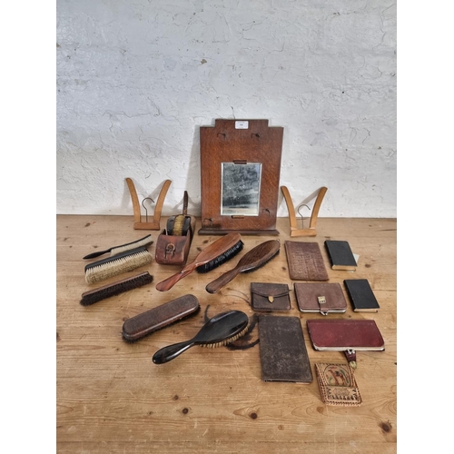 505 - A collection of vintage grooming and fashion accessories to include oak wall mountable mirror, cloth... 