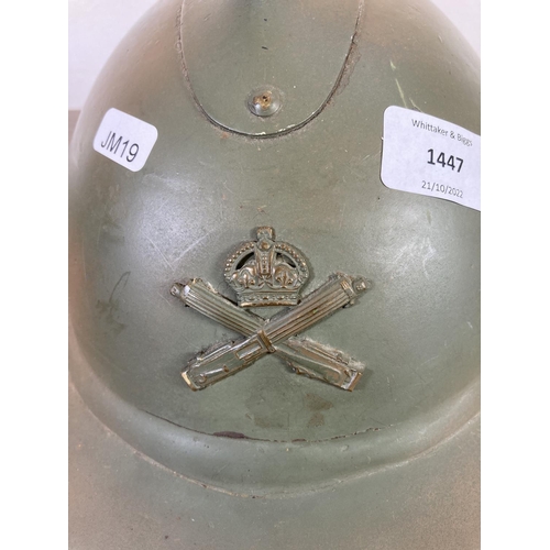 512 - A WWII French Adrian helmet with machine gun corps badge to front