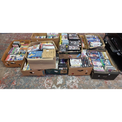 768 - Twelve boxes containing approx. three hundred and seventy VHS video tapes to include music titles, f... 