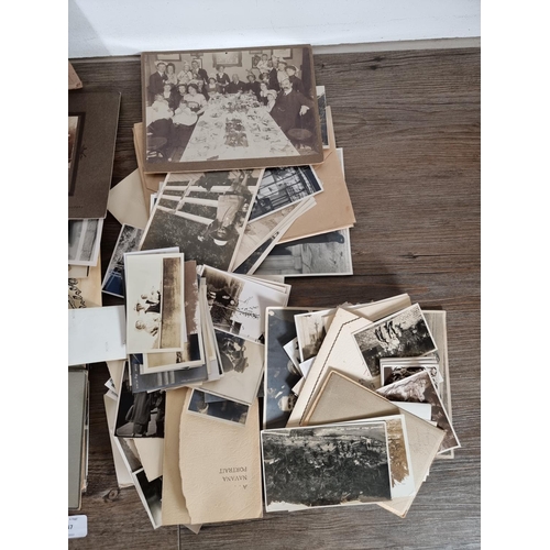 447 - A large collection of antique and vintage black and white photographs