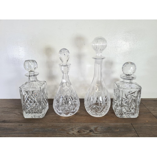 261 - Five cut glass decanters - largest approx. 34cm high