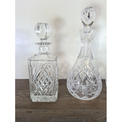 261 - Five cut glass decanters - largest approx. 34cm high