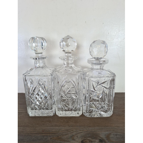 261 - Five cut glass decanters - largest approx. 34cm high