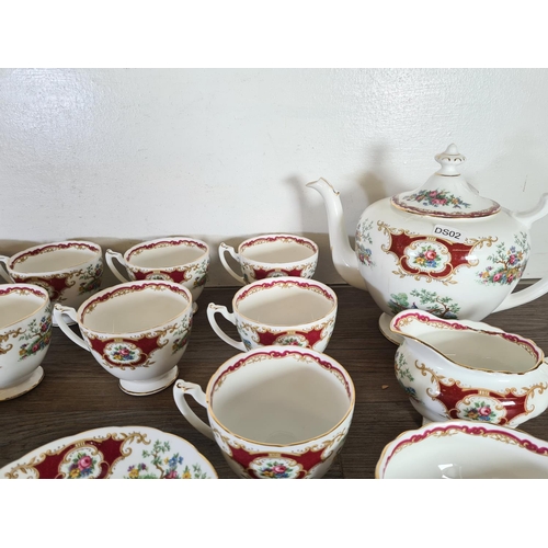 283 - Forty one pieces of Coalport Broadway Marone bone china