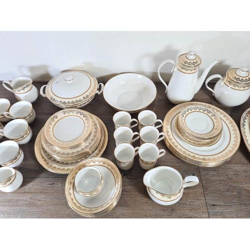 290 - A large collection of Elizabethan Swiss Cottage hand decorated fine bone china