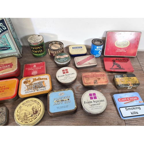 295 - A collection of vintage advertising tins to include Jacob's Cream Crackers, Nescafe Instant Coffee, ... 