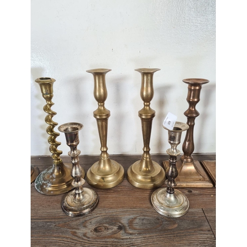 309 - Four pairs of candlesticks to include brass barley twist, silver plated etc.