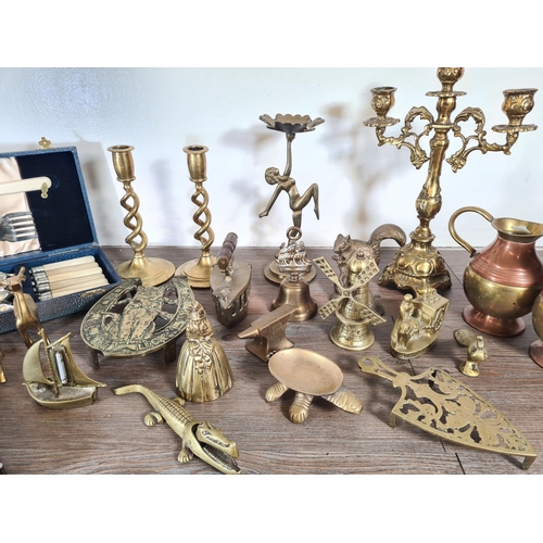 315 - A collection of metalware to include Rococo style brass three branch candelabra, Art Deco style bras... 