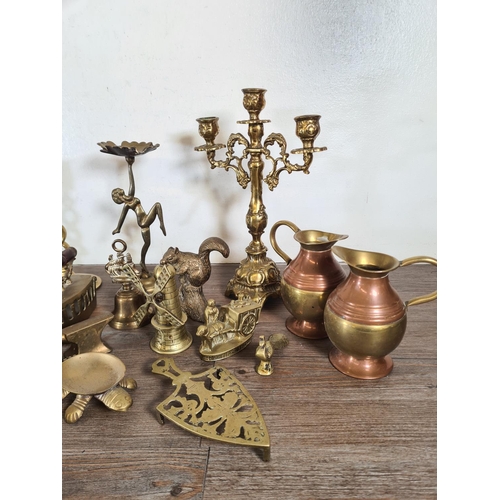 315 - A collection of metalware to include Rococo style brass three branch candelabra, Art Deco style bras... 