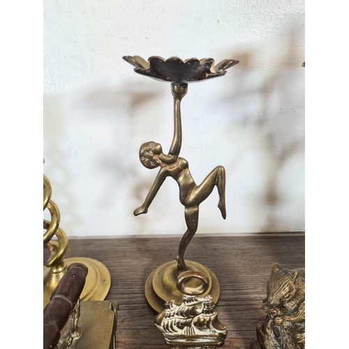 315 - A collection of metalware to include Rococo style brass three branch candelabra, Art Deco style bras... 