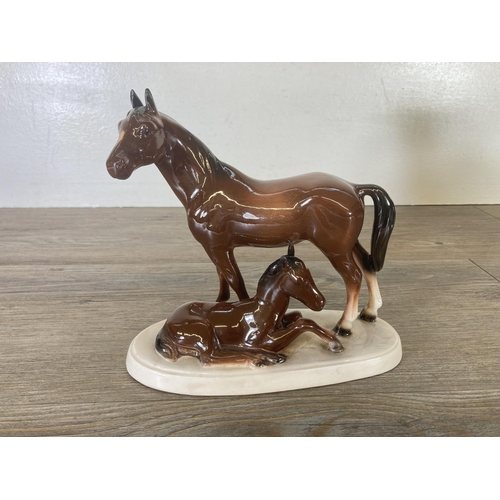 247 - Four ceramic horse figurines - largest approx. 27cm high