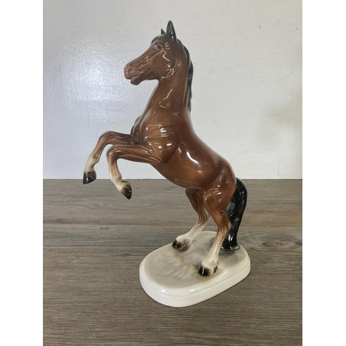 247 - Four ceramic horse figurines - largest approx. 27cm high