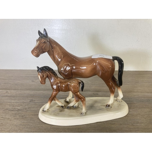 247 - Four ceramic horse figurines - largest approx. 27cm high