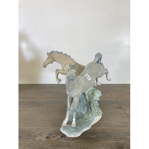 249 - Three ceramic horse figurines to include Nao by Lladro, Miquel Requena etc.