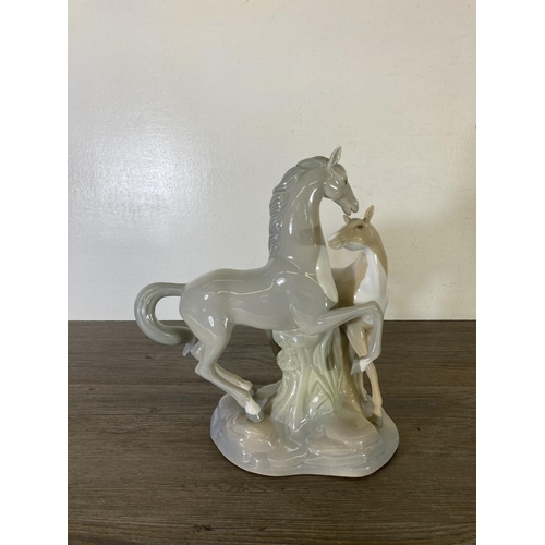 249 - Three ceramic horse figurines to include Nao by Lladro, Miquel Requena etc.