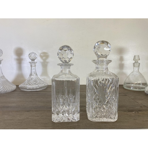 255 - Six glass decanters - largest approx. 29cm high