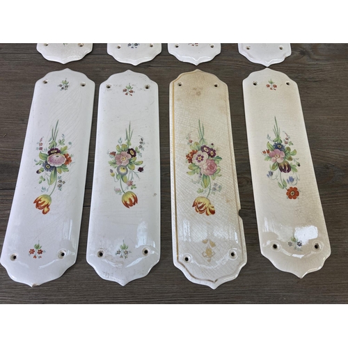 256 - Eight hand painted ceramic door plates - approx. 28cm high x 8cm wide