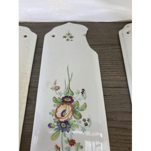 256 - Eight hand painted ceramic door plates - approx. 28cm high x 8cm wide