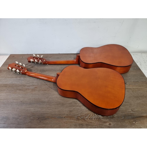 790 - Two child's Herald MG104N nylon strung classical guitars