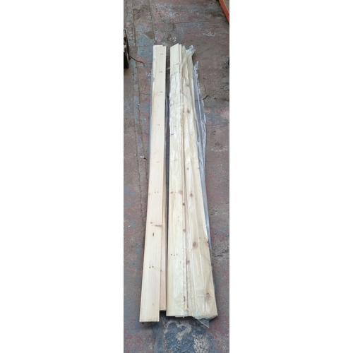 553 - A collection of pine slats - approx. 247cm high x 10cm wide