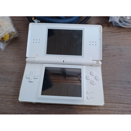 727 - A collection of items to include Nintendo DS Lite hand held games console, JVC car stereo, Bush Free... 