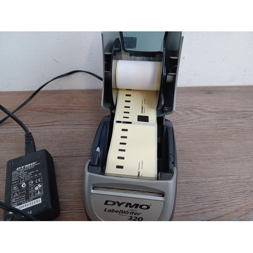 733 - A Dymo LabelWriter 320 II label printer with power adaptor