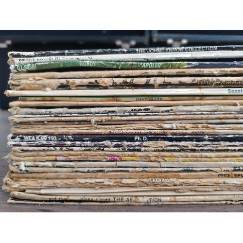 777 - Two record cases containing a collection of LP, 12