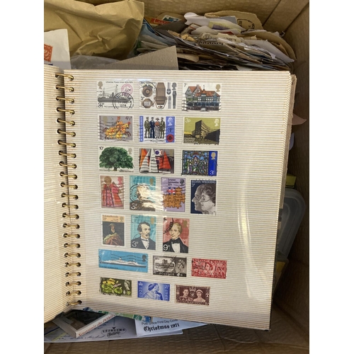 843 - A box containing a collection of world stamps